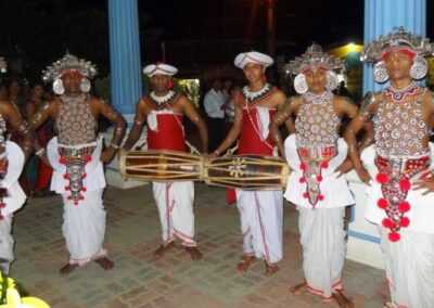 A group of men in traditional Indian clothing, representing the cultural diversity of Sri Lanka.